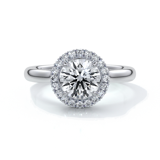 one carat round cut diamond with halo enhanced in a cathedral setting. Set in platinum