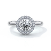 one carat round cut diamond with halo enhanced in a cathedral setting. Set in platinum