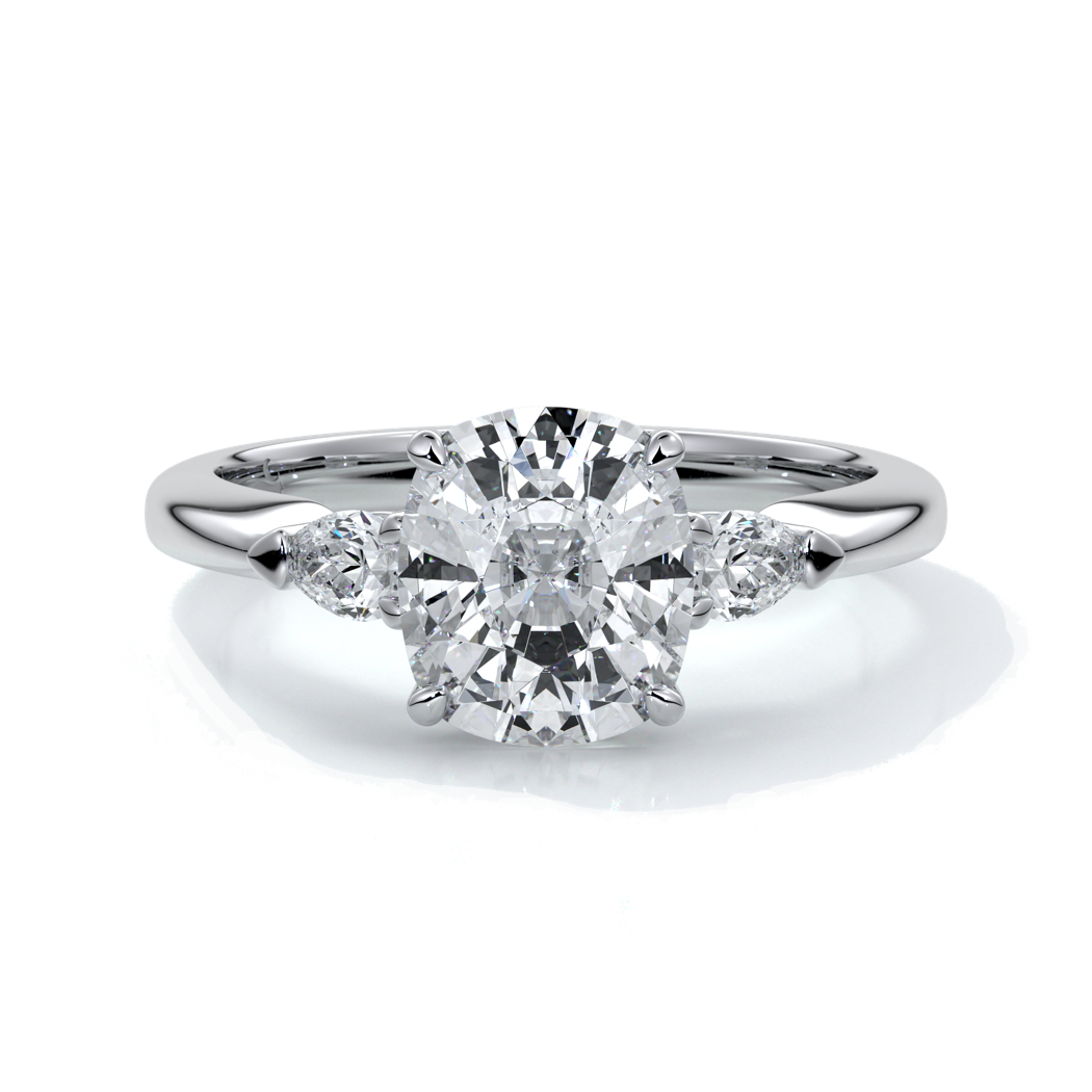 Platinum ring with a cushion cut center diamond and pear diamonds enhancing the trilogy