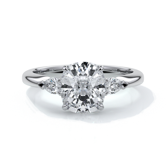 Platinum ring with a cushion cut center diamond and pear diamonds enhancing the trilogy