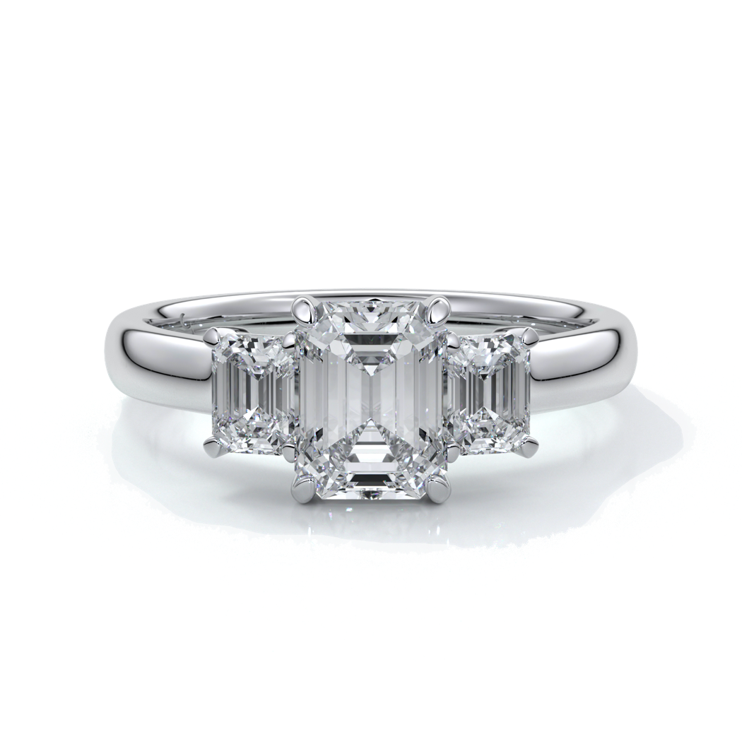 Platinum eighteen carat Stalla emerald cut trilogy diamond ring, with cathedral setting
