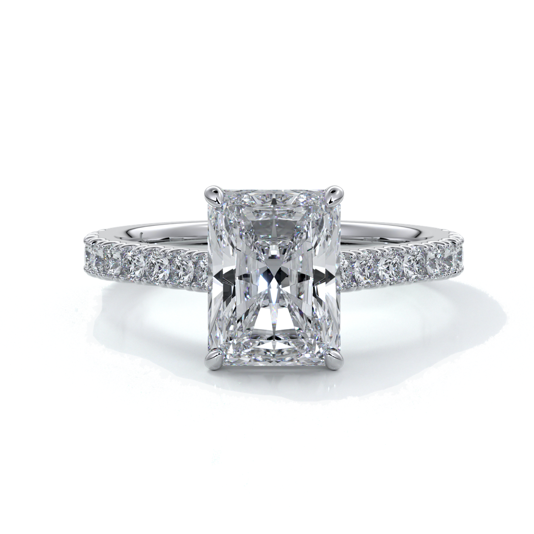 Ring with radiant cut diamond enhanced in a cathedral setting with a scalloped diamond band, cast in platinum