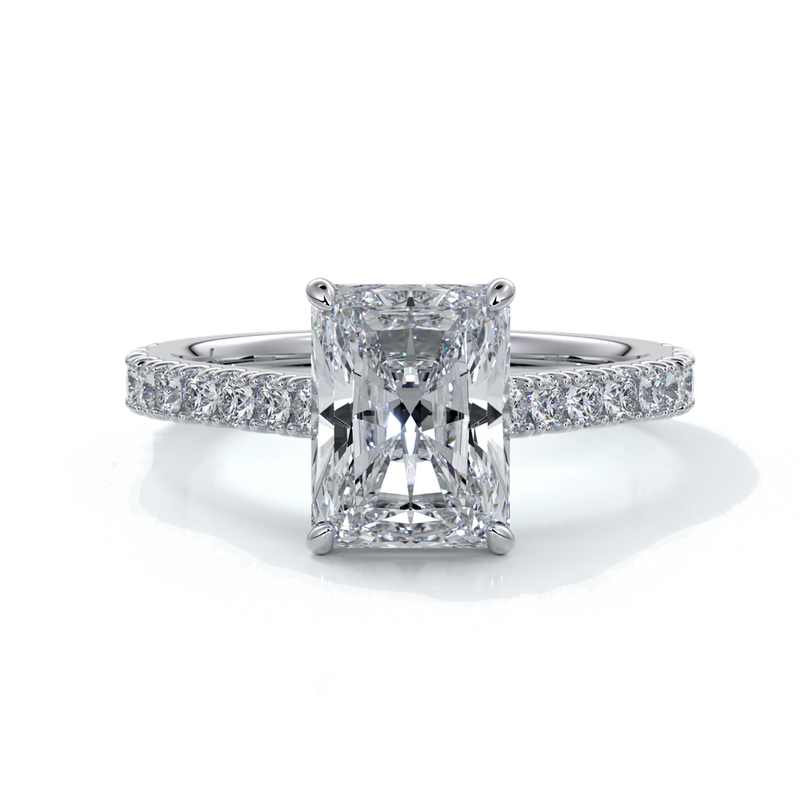 Ring with radiant cut diamond enhanced in a cathedral setting with a scalloped diamond band, cast in platinum
