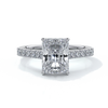 Ring with radiant cut diamond enhanced in a cathedral setting with a scalloped diamond band, cast in platinum