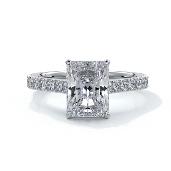 Ring with radiant cut diamond enhanced in a cathedral setting with a scalloped diamond band, cast in platinum