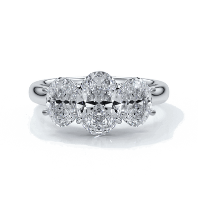 Engagement ring with a straight trilogy of oval diamonds set in platinum