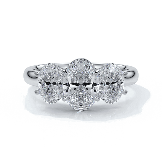 Engagement ring with a straight trilogy of oval diamonds set in platinum