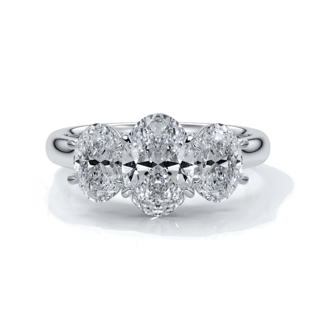 Engagement ring with a straight trilogy of oval diamonds set in platinum