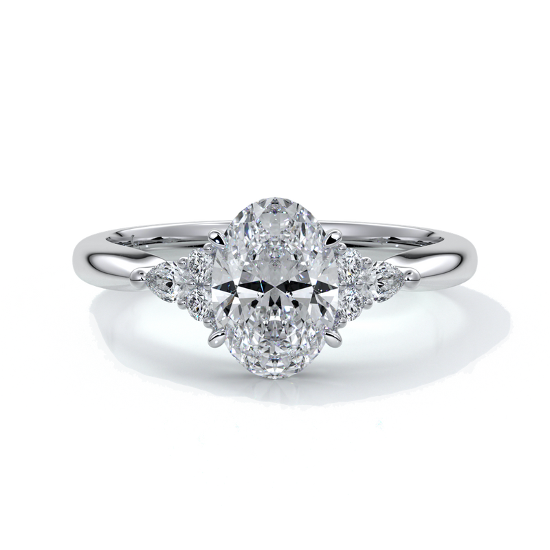 Platinum Engagement ring with trilogy style with smaller diamonds on either side
