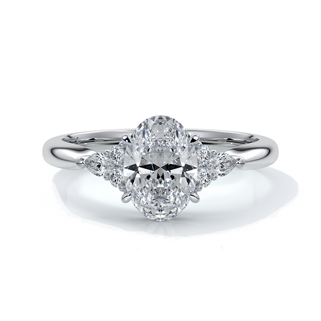 Platinum Engagement ring with trilogy style with smaller diamonds on either side